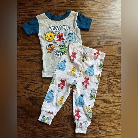 Sesame Street, Carter’s lot of pajamas set boy/ girl Sz. 12 mo NWT - Picture 1 of 9